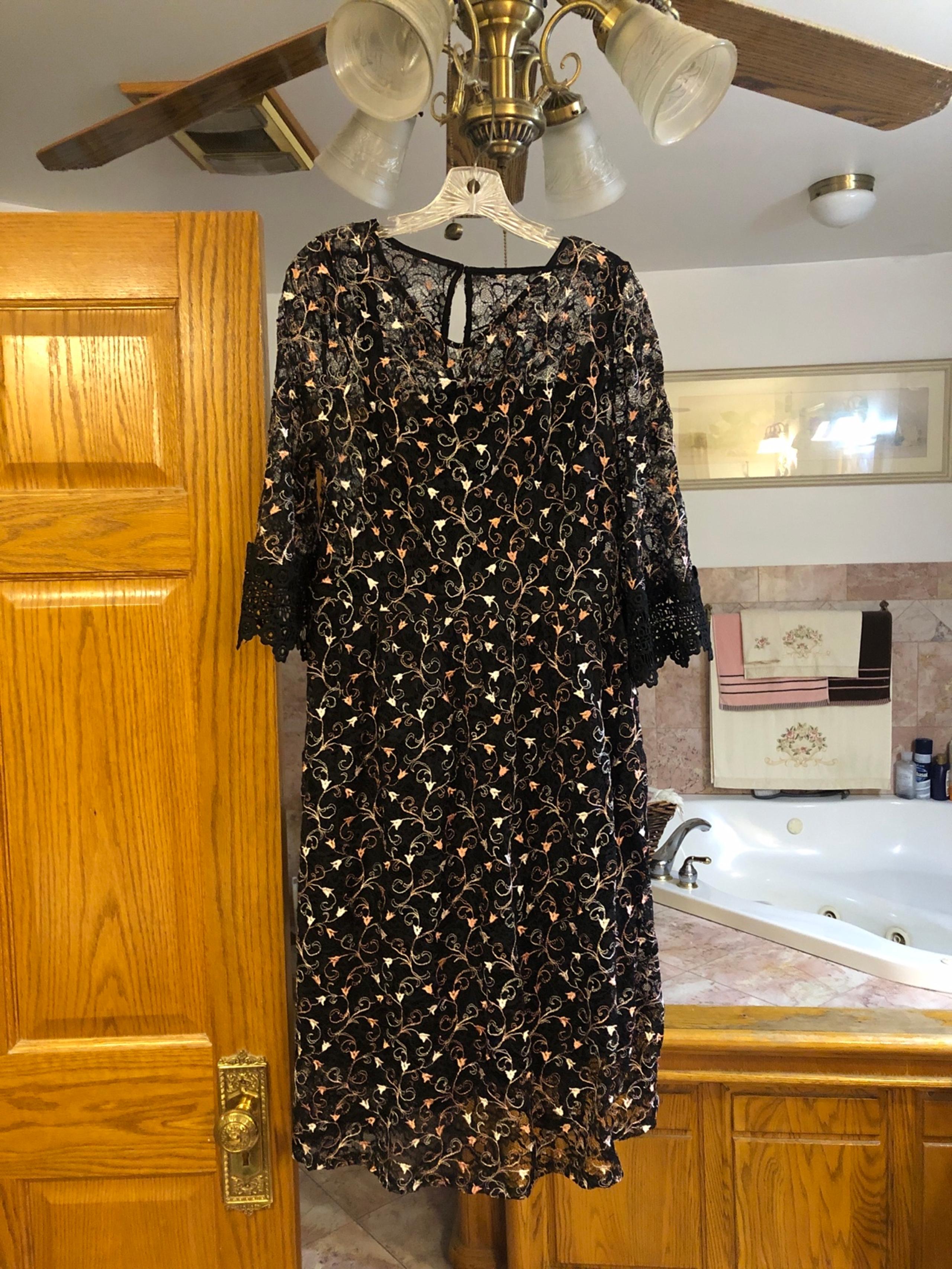 Black dress with embroidery on the material