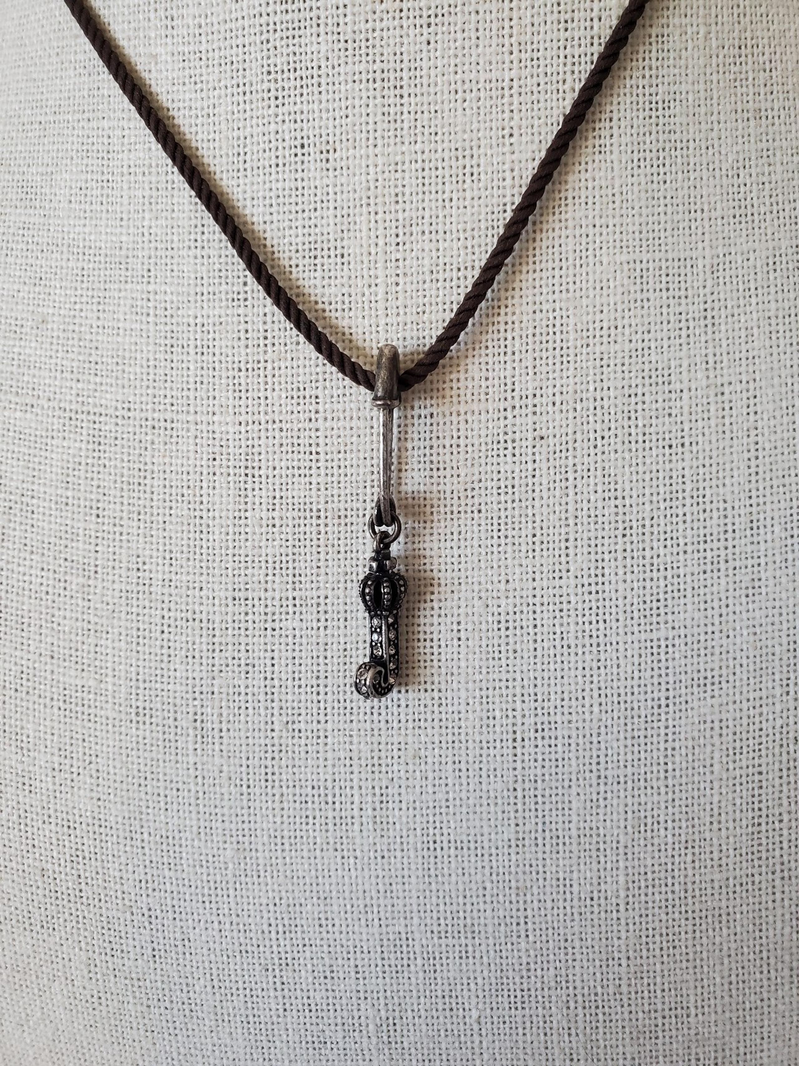 Juicy Couture Silver Plated J Safety Pin Brown Cord Pendant Necklace