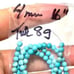 4 mm turquoise strand of beads. 405