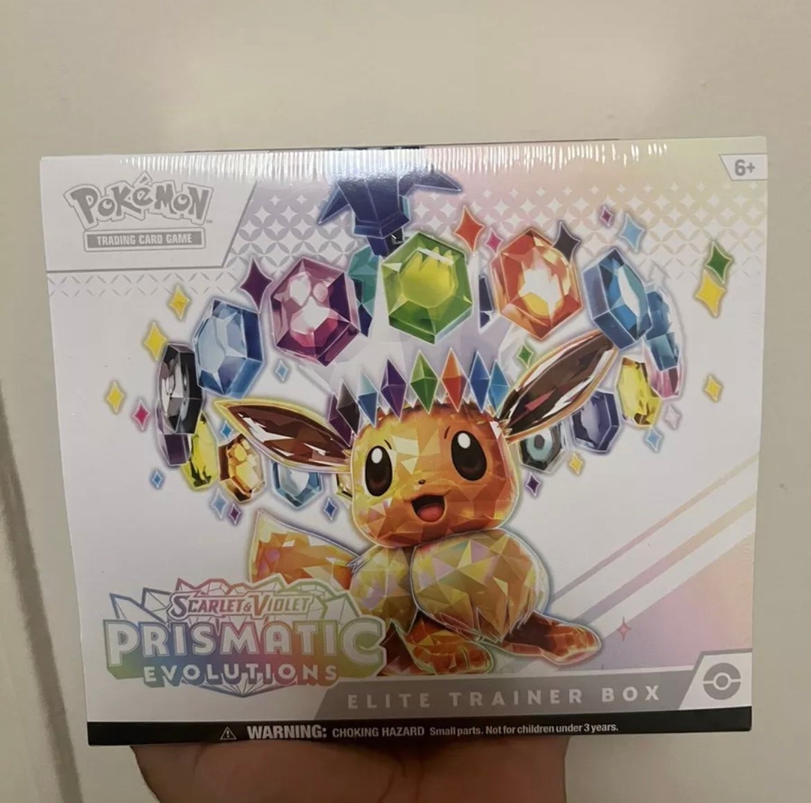 Pokémon Prismatic Evolutions ETB + Random Modern Booster Pack Ships Same Day