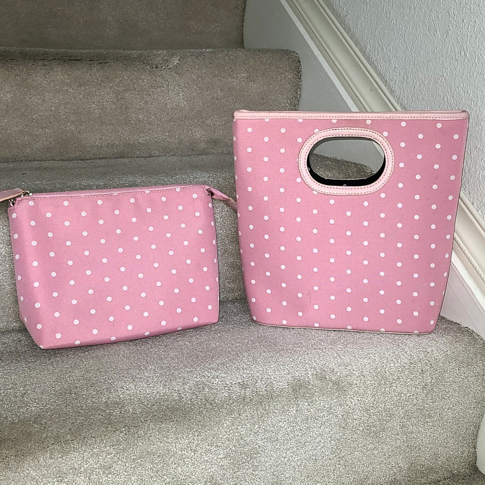 Clutch pink material with white polka dots plus matching toiletry bag.