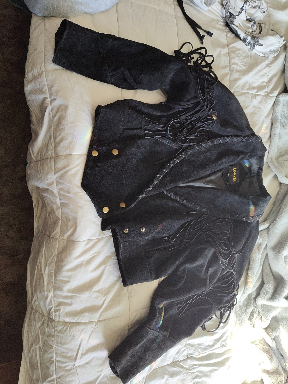 Black suede jacket with fringe. Size med, 10.