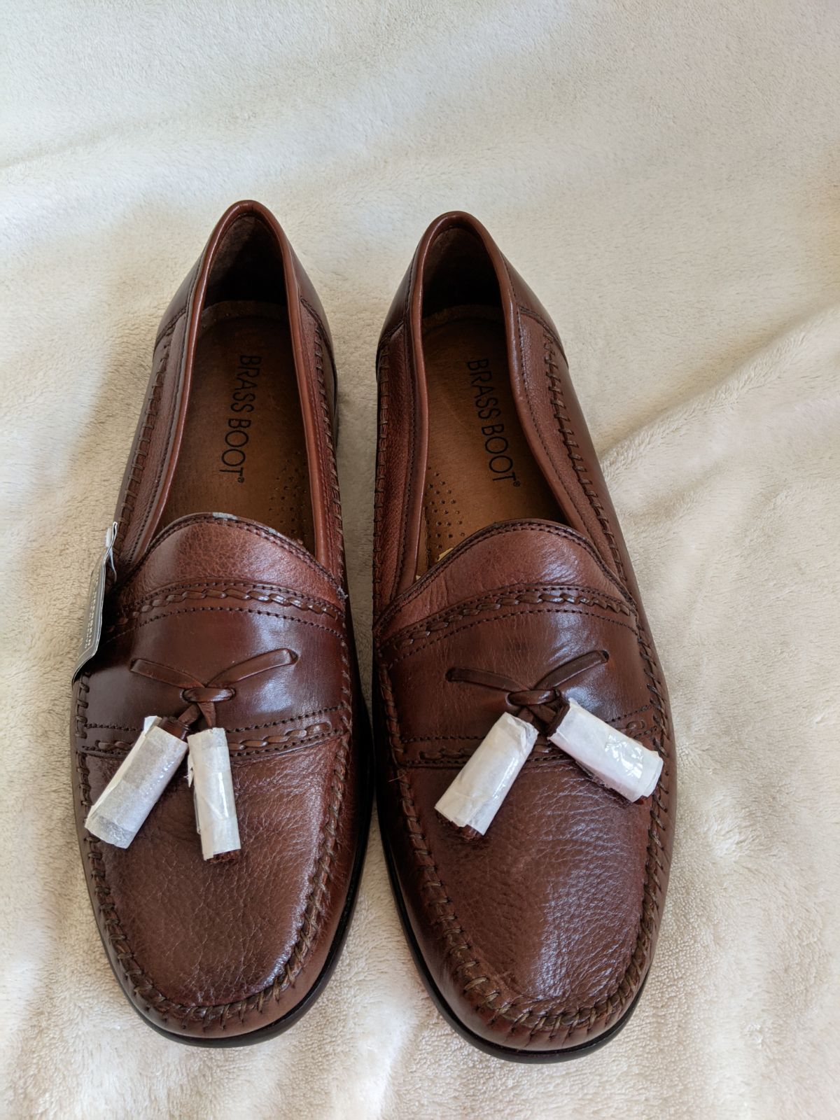 Brass boot tassel loafers