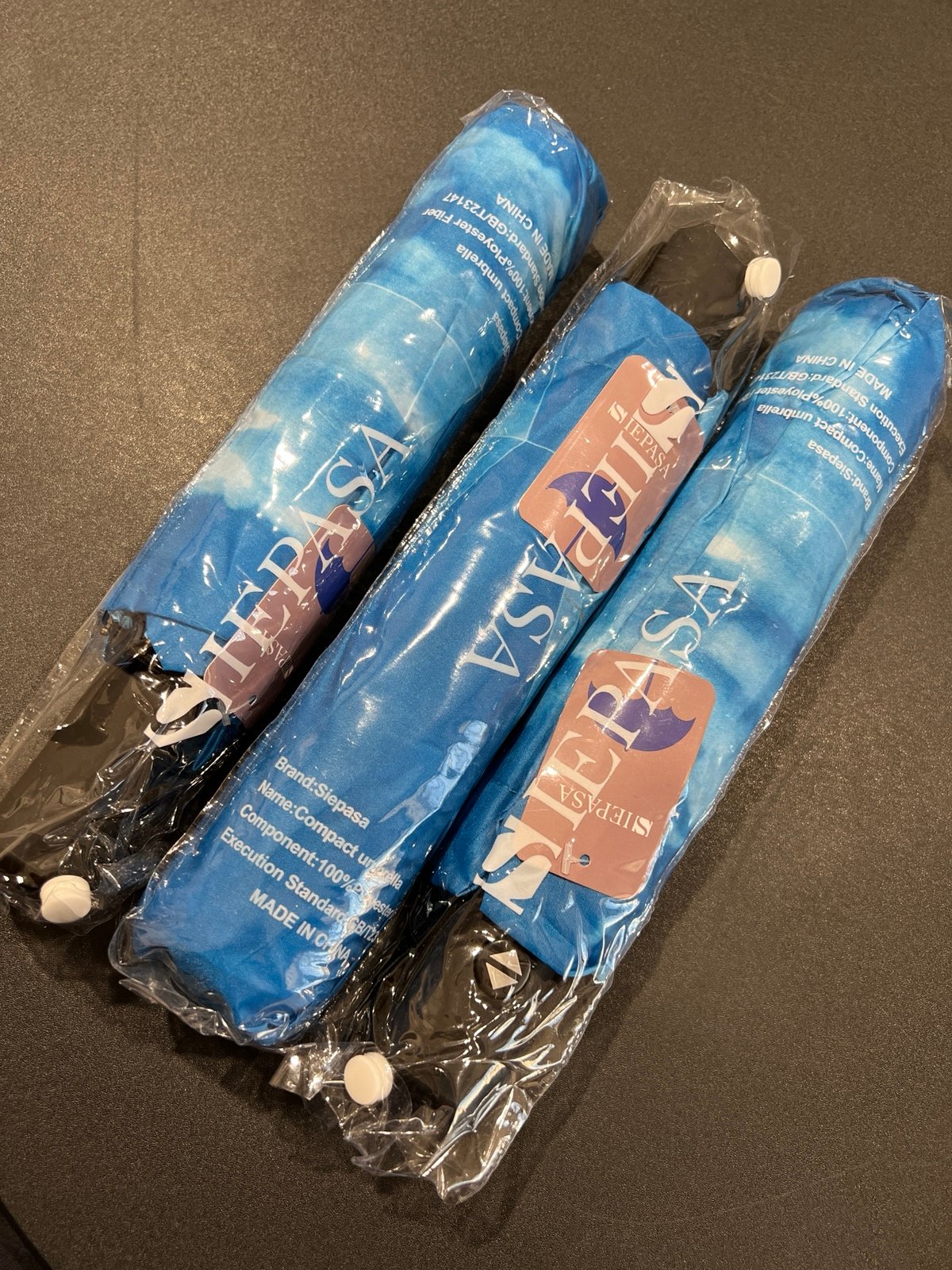 3 brand new full size umbrellas