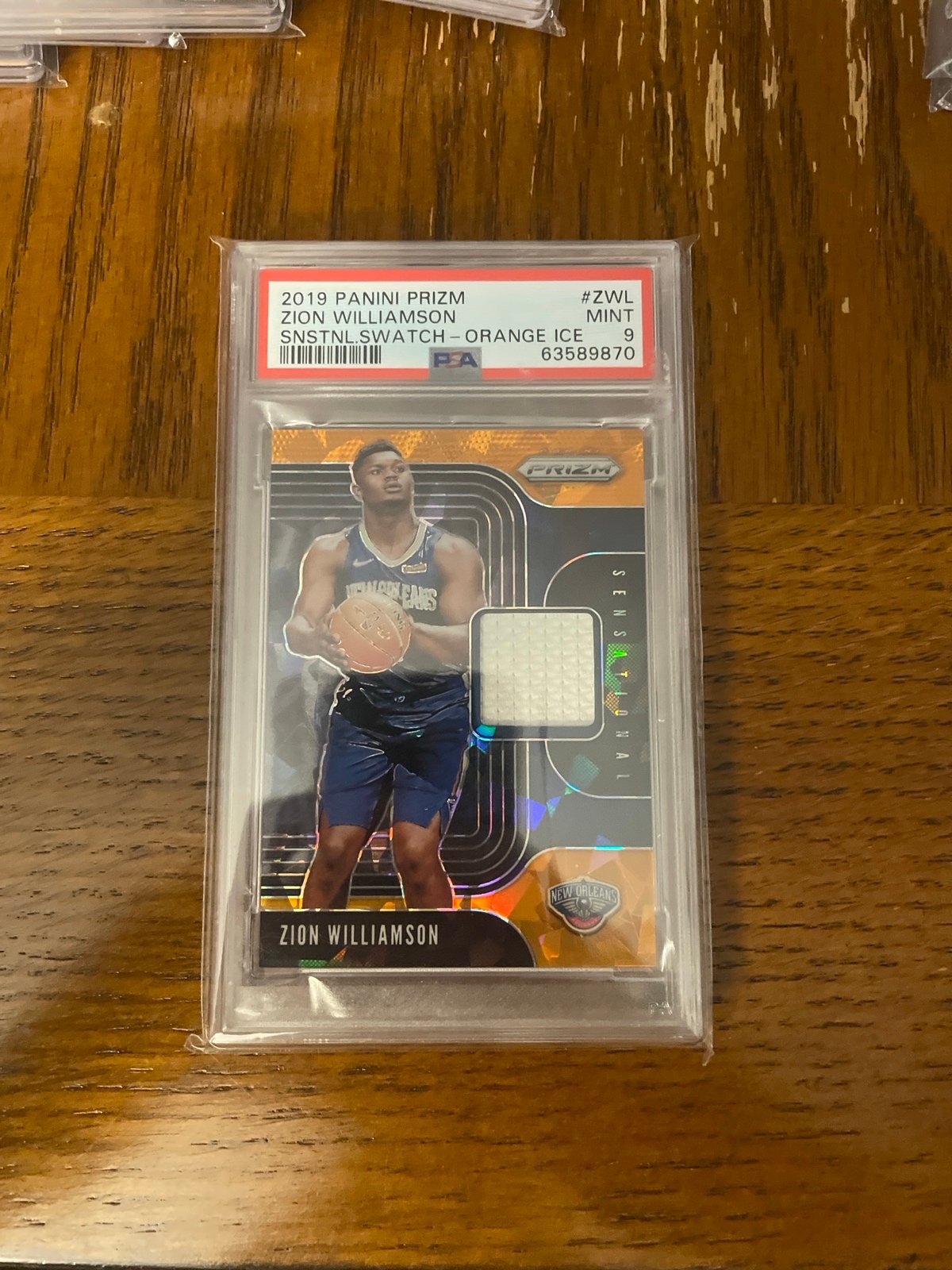 2019 Panini Prizm Zion Williamson Sensational Swatch Orange Ice PSA 9
