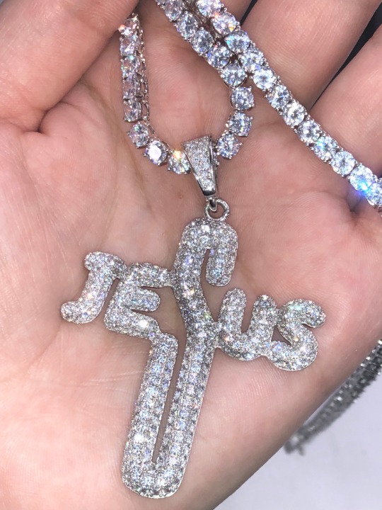 Iced out 24' Tennis Chain and pendant.