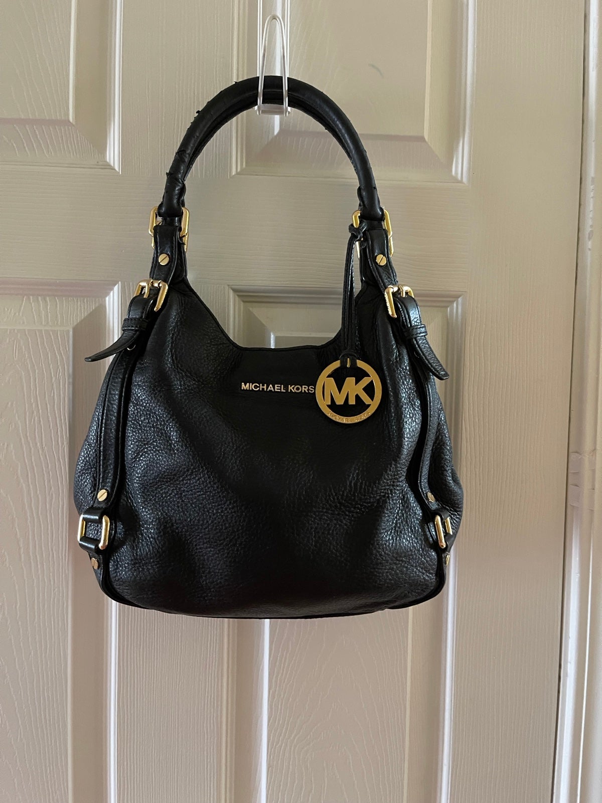 Michael Kors Black Pebble Leather Satchel with gold tone hardwares and accents.t