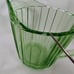 Green Uranium Depression Glass creamer and sugar. Pinwheel pattern