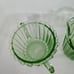 Green Uranium Depression Glass creamer and sugar. Pinwheel pattern