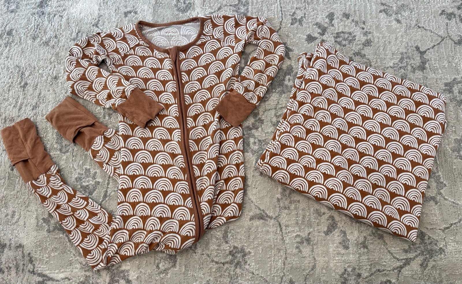 Little sleepies rust rainbow zippy and swaddle blanket