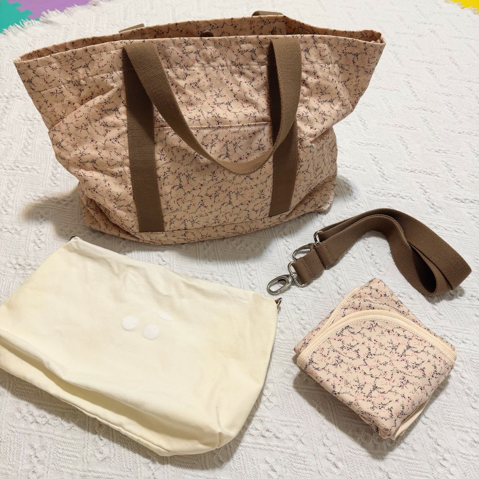 Bonpoint diaper bag with diaper changing pad and pouch