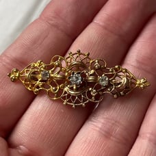 Antique gold plated filigree rhinestone pin