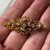 Antique gold plated filigree rhinestone pin