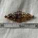 Antique gold plated filigree rhinestone pin