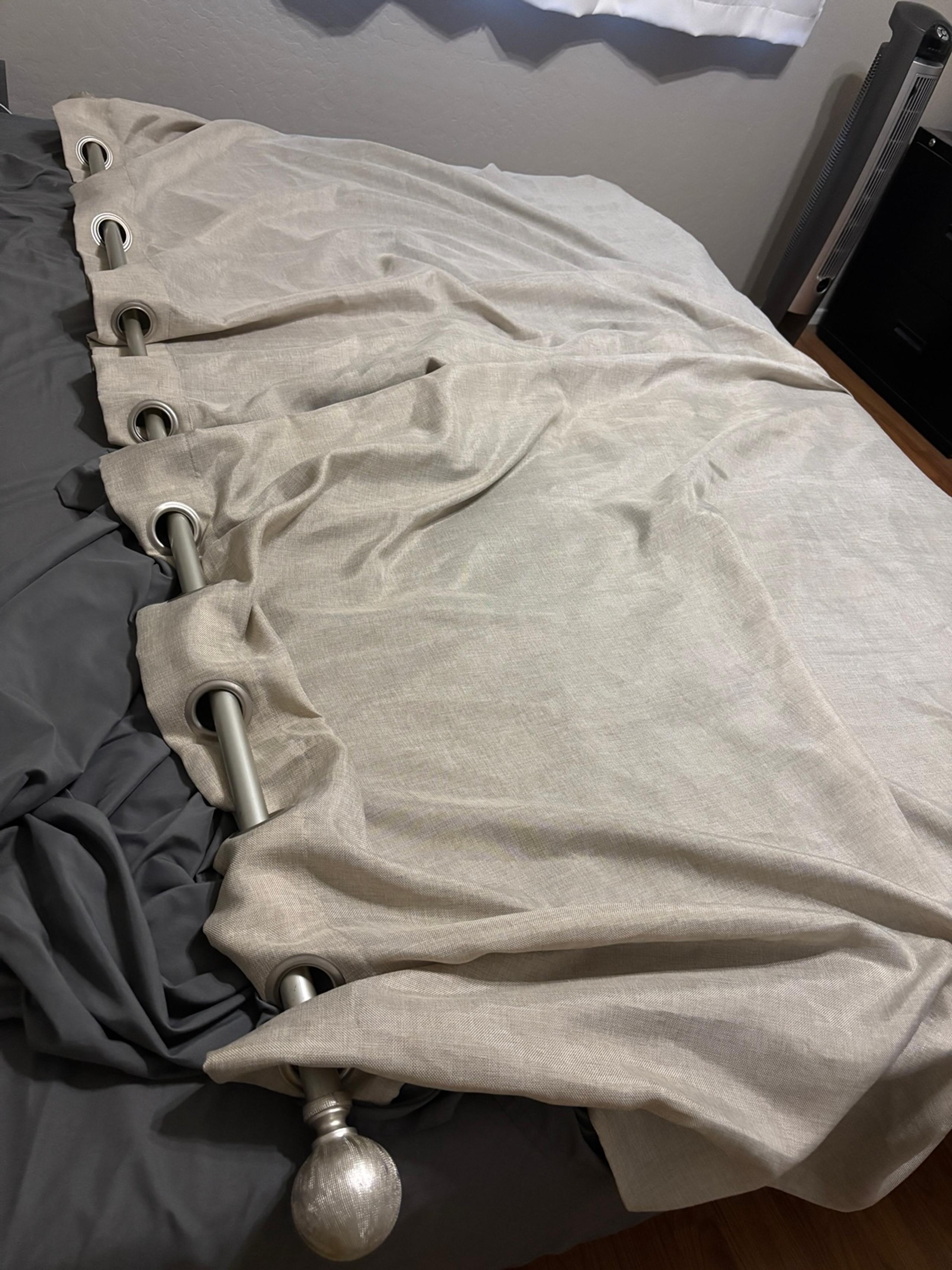 2 curtains and curtain rod
