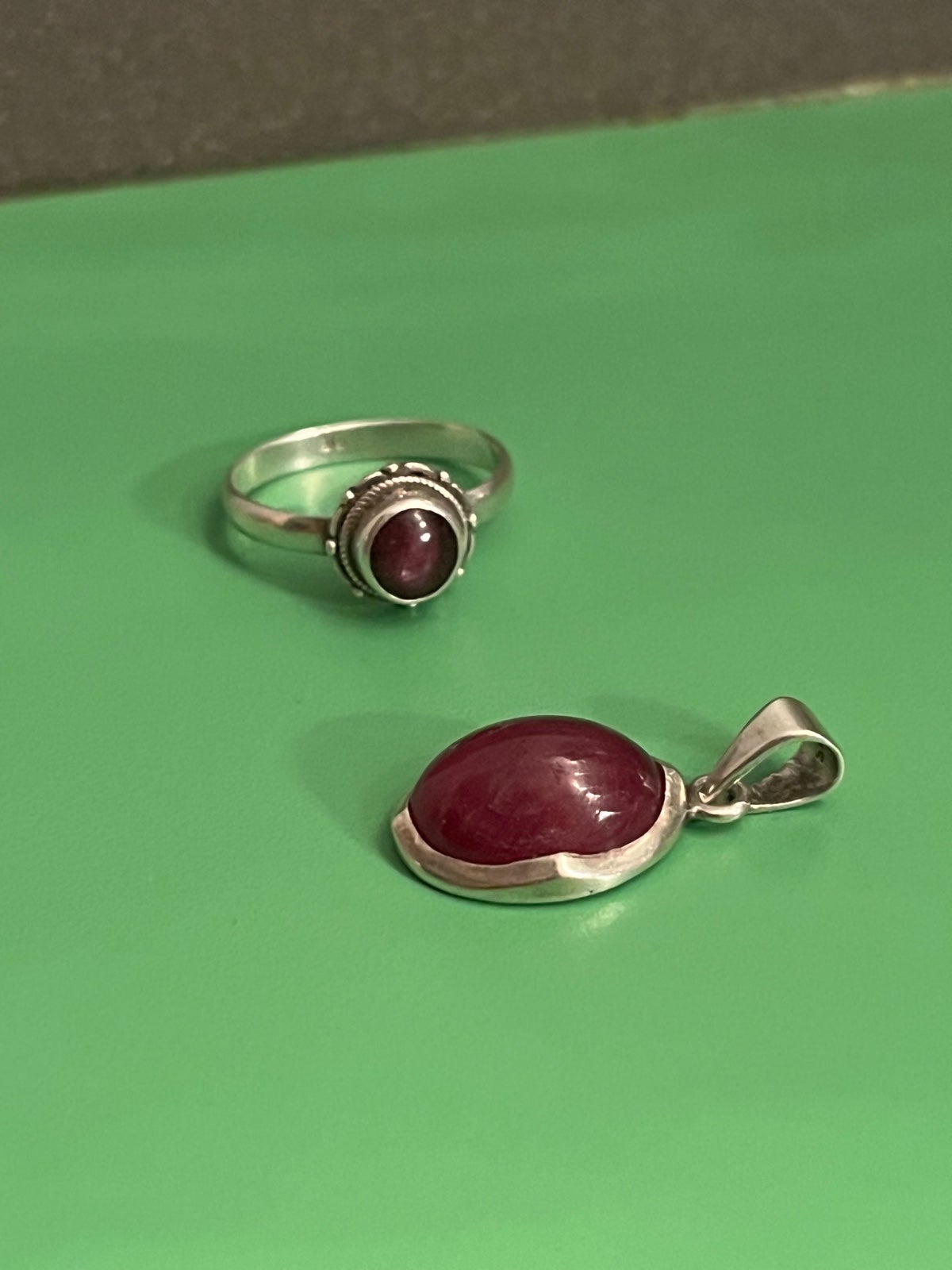A ruby pendant, and a size 8 ruby ring