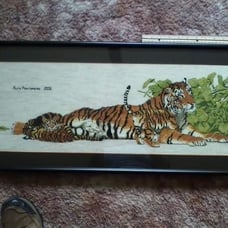 Completed counted cross stitch of tigers