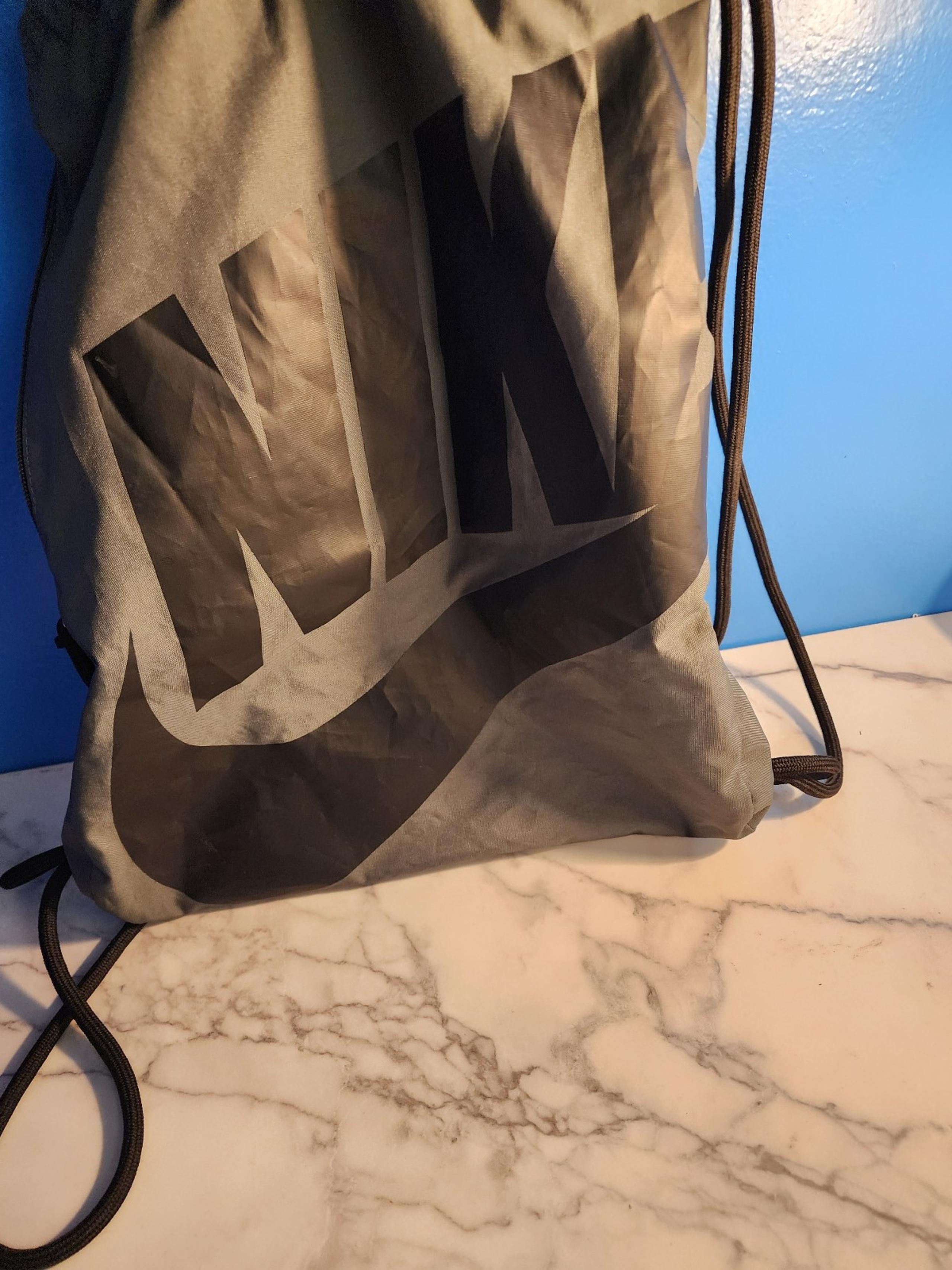 Gray and black Nike backpack