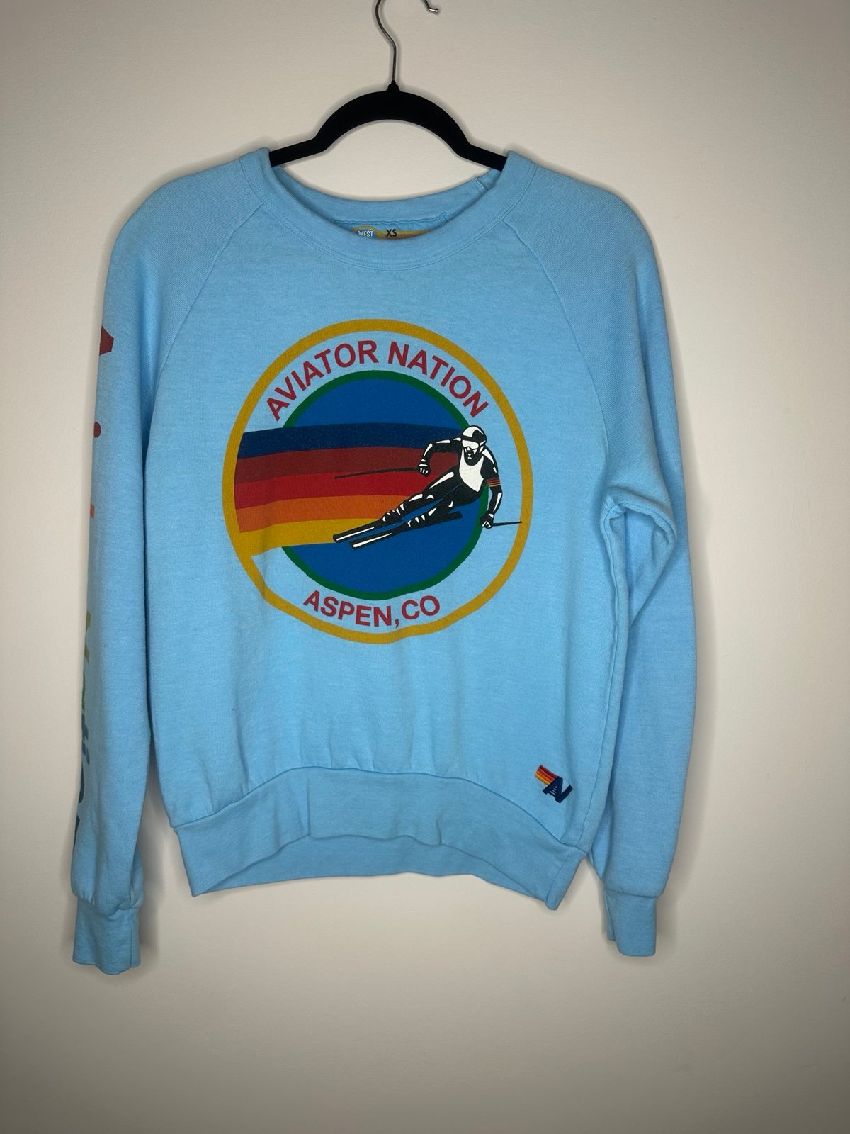 Cozy up in iconic California style with this Aviator Nation sweater. Hand-stitch