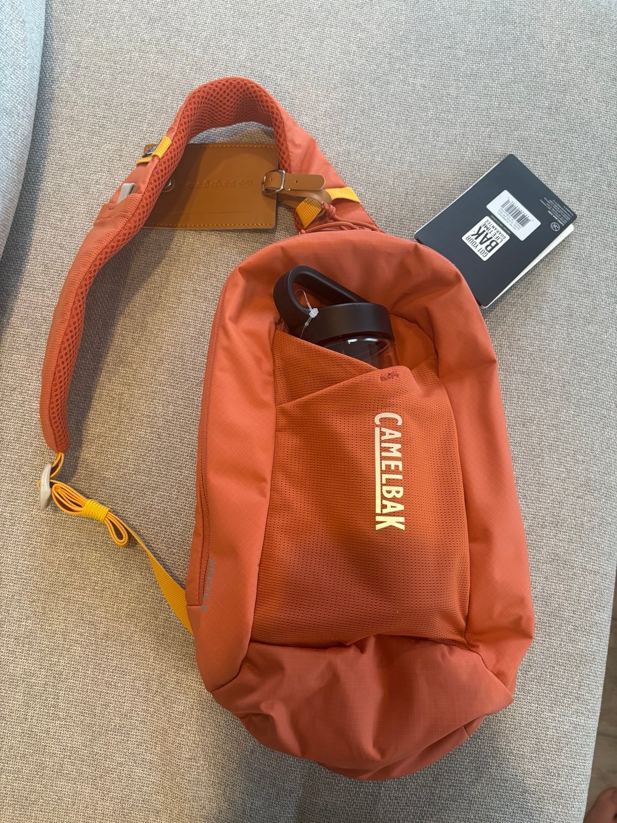 Orange Camelbak shoulder bag