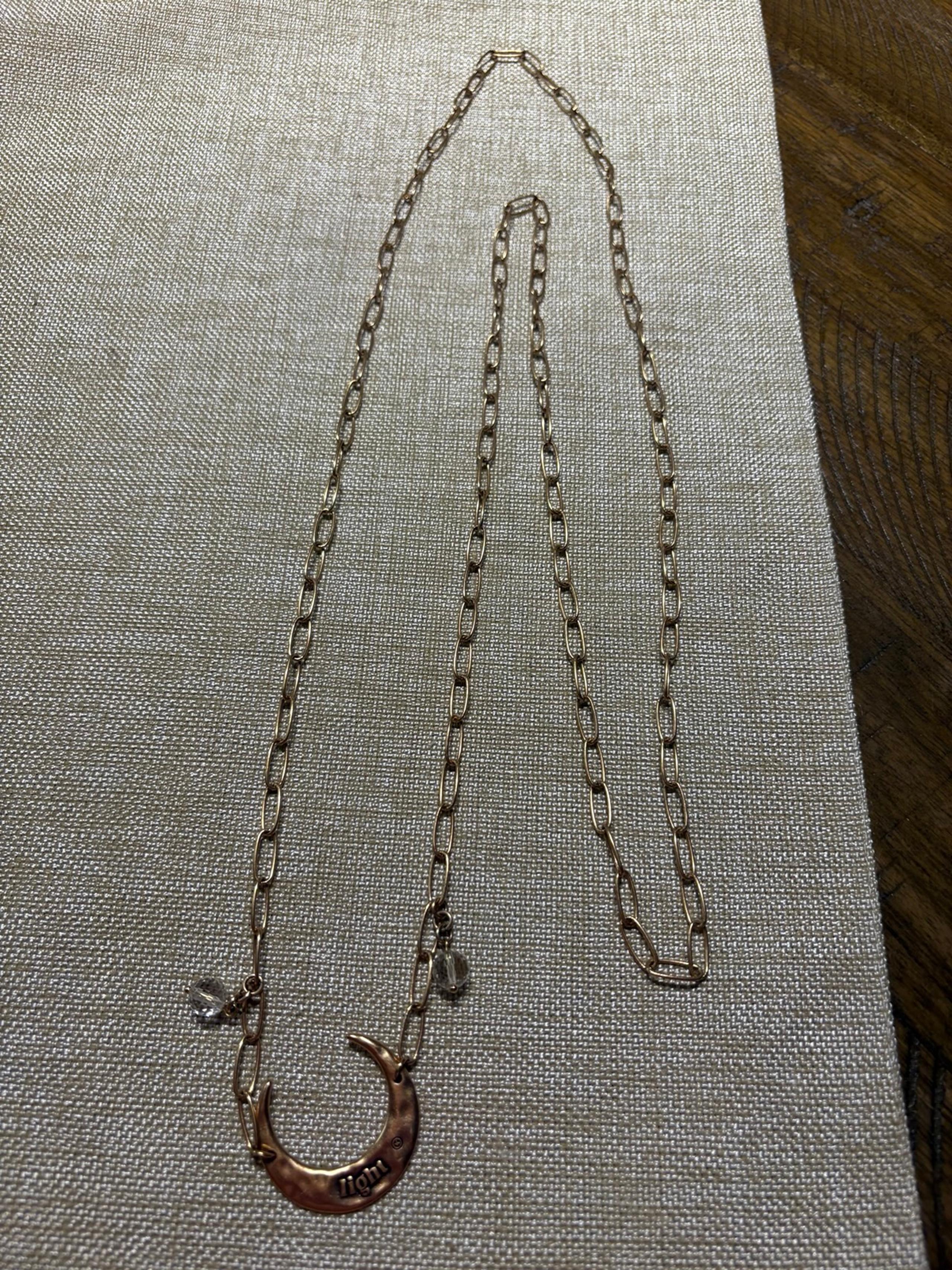 Light Crescent Moon Long Chain Necklace by Katia Designs.