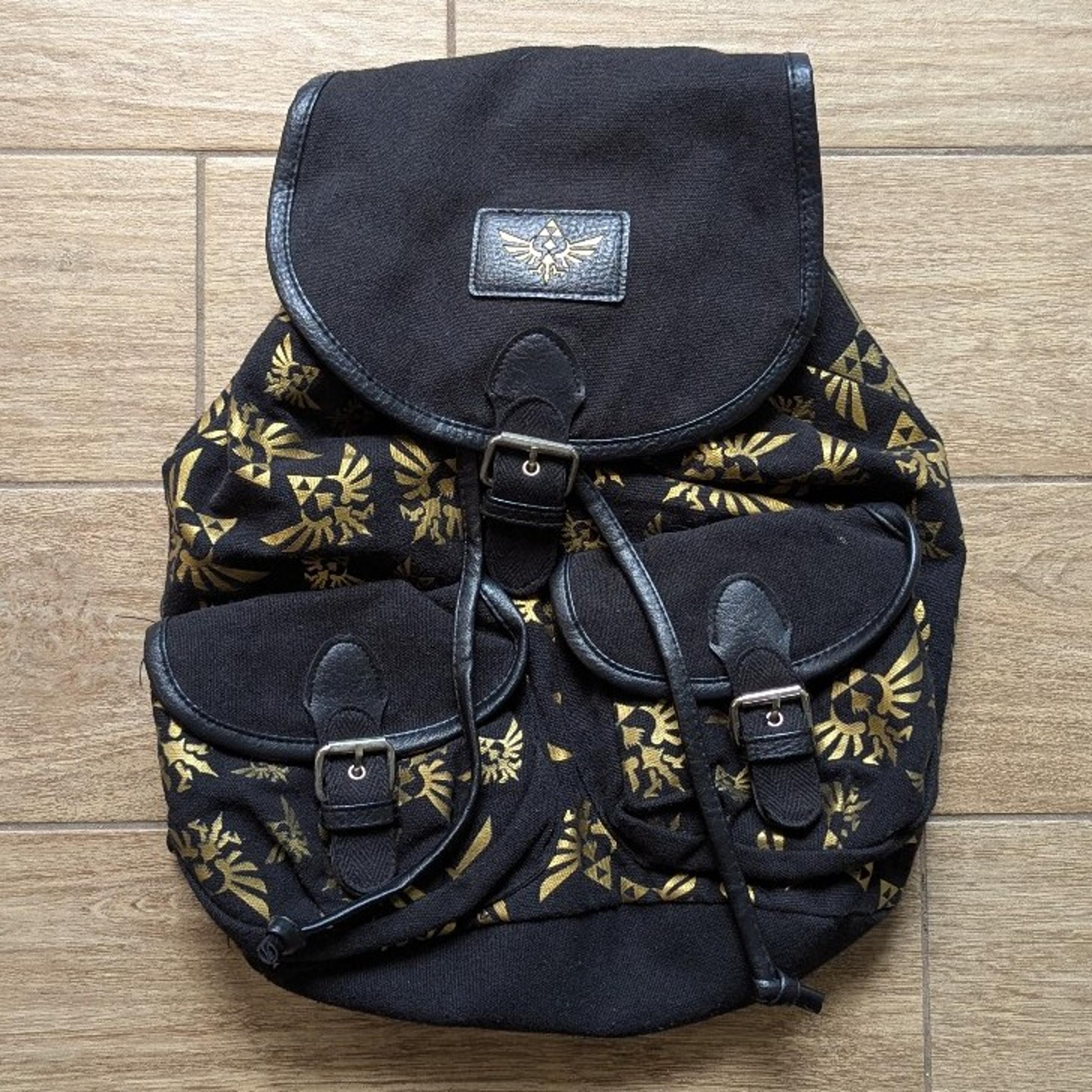 The Legend of Zelda Skyward Sword Black and Gold Triforces Backpack