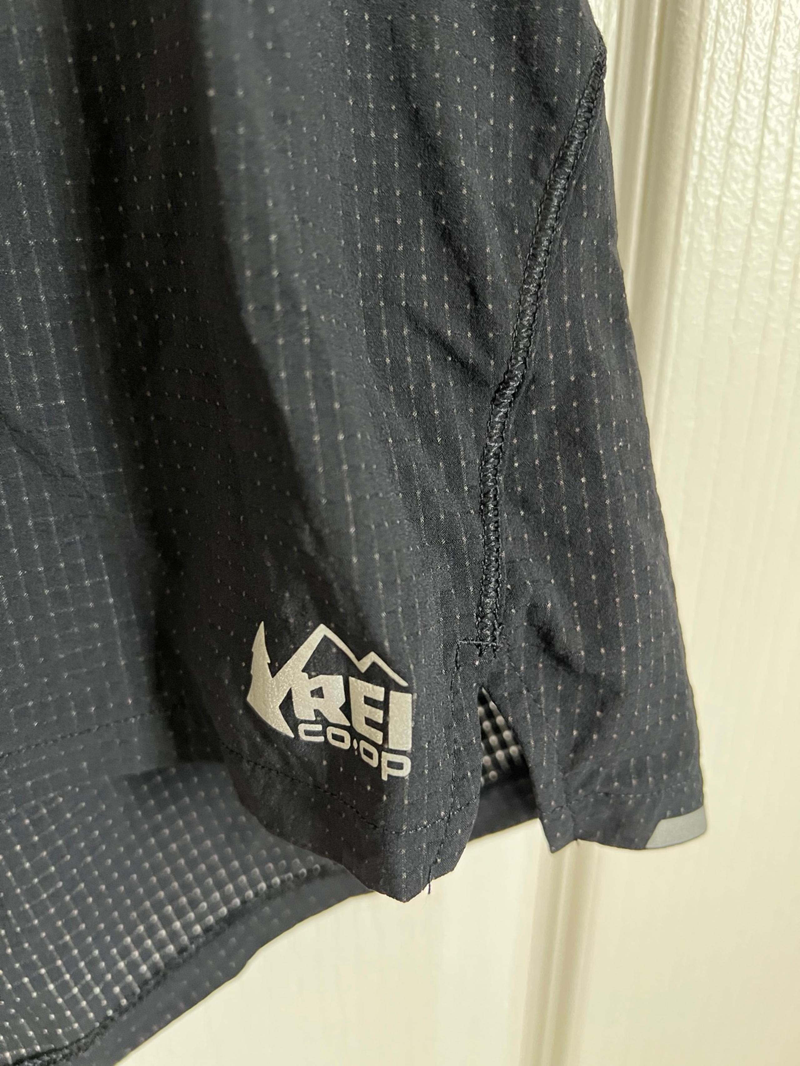 REI Black athletic shorts, lower back pocket