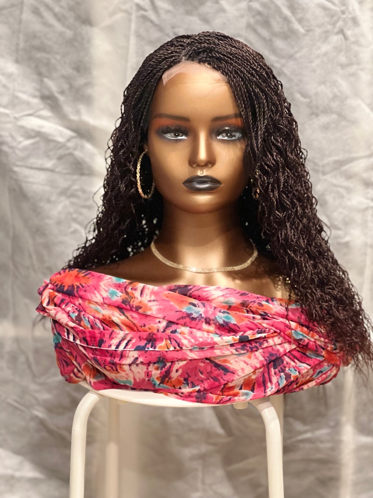 Handmade braided waterwave brown wig.length is 20inches long made on a frontal.