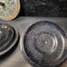 Black and blue enamelware lids