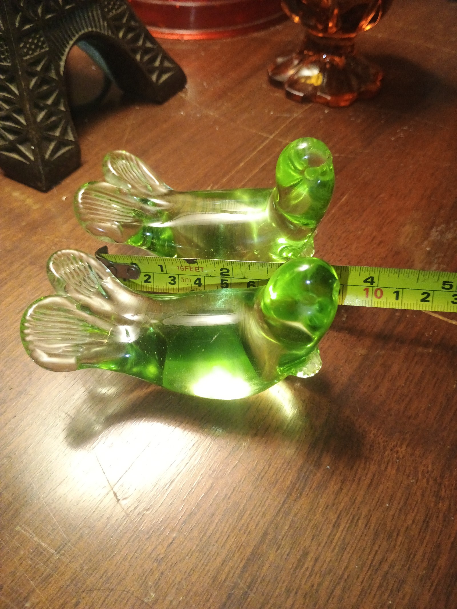 Pair of green glass seal paperweights