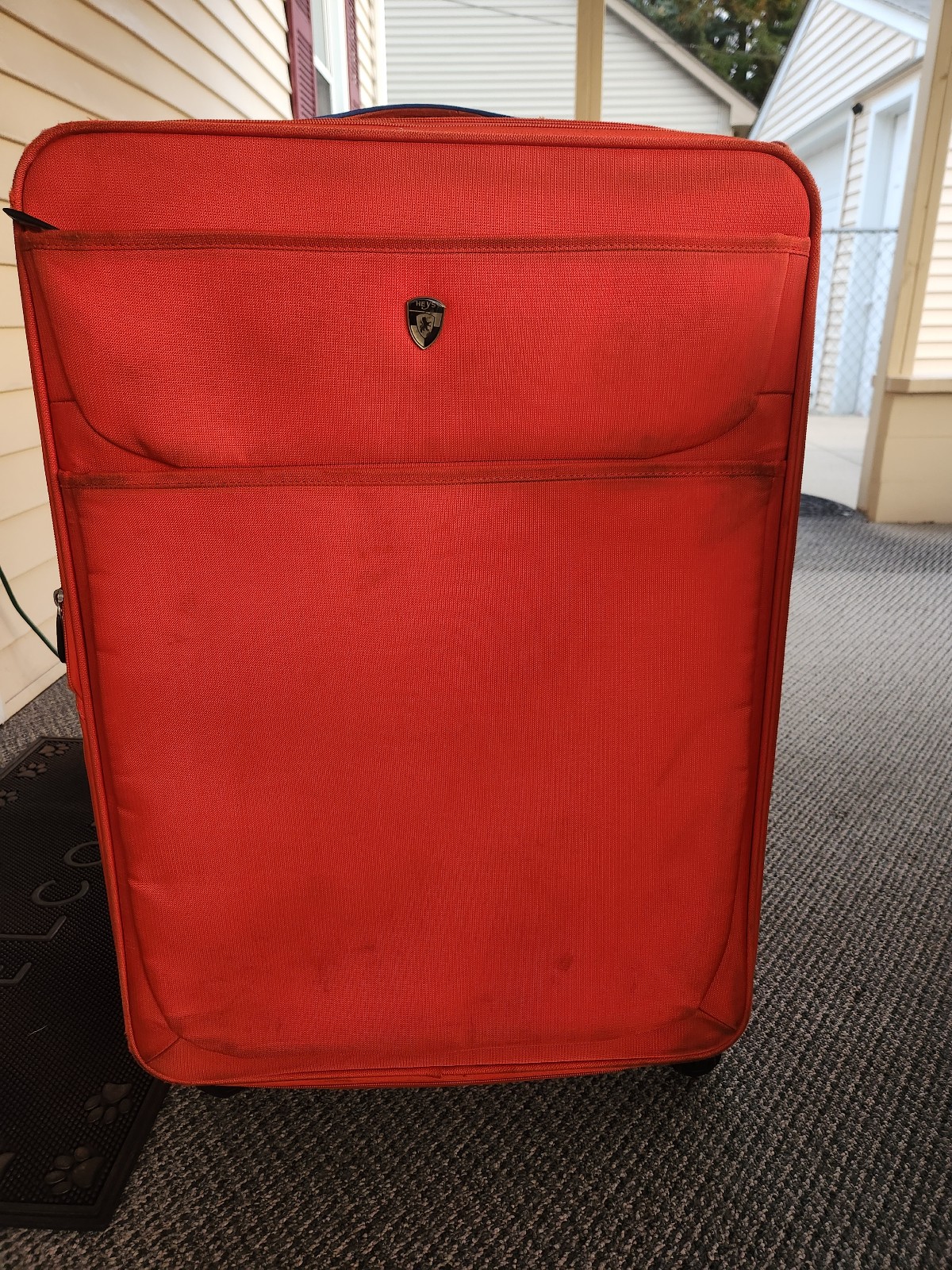 Heys lightweight orange spinner 30in suitcase