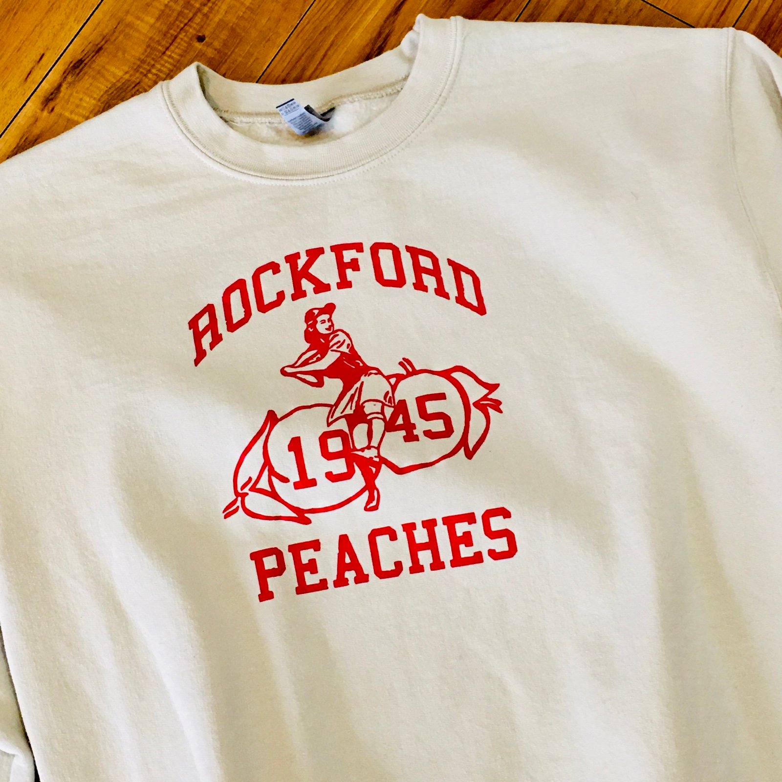 Rockford Peaches baseball sweatshirt pullover tan ivory red graphics athleisure