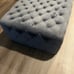 Gray tufted ottoman