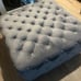 Gray tufted ottoman