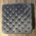 Gray tufted ottoman