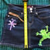 Upcycled Y2k style denim mini skirt with a unique design on the front