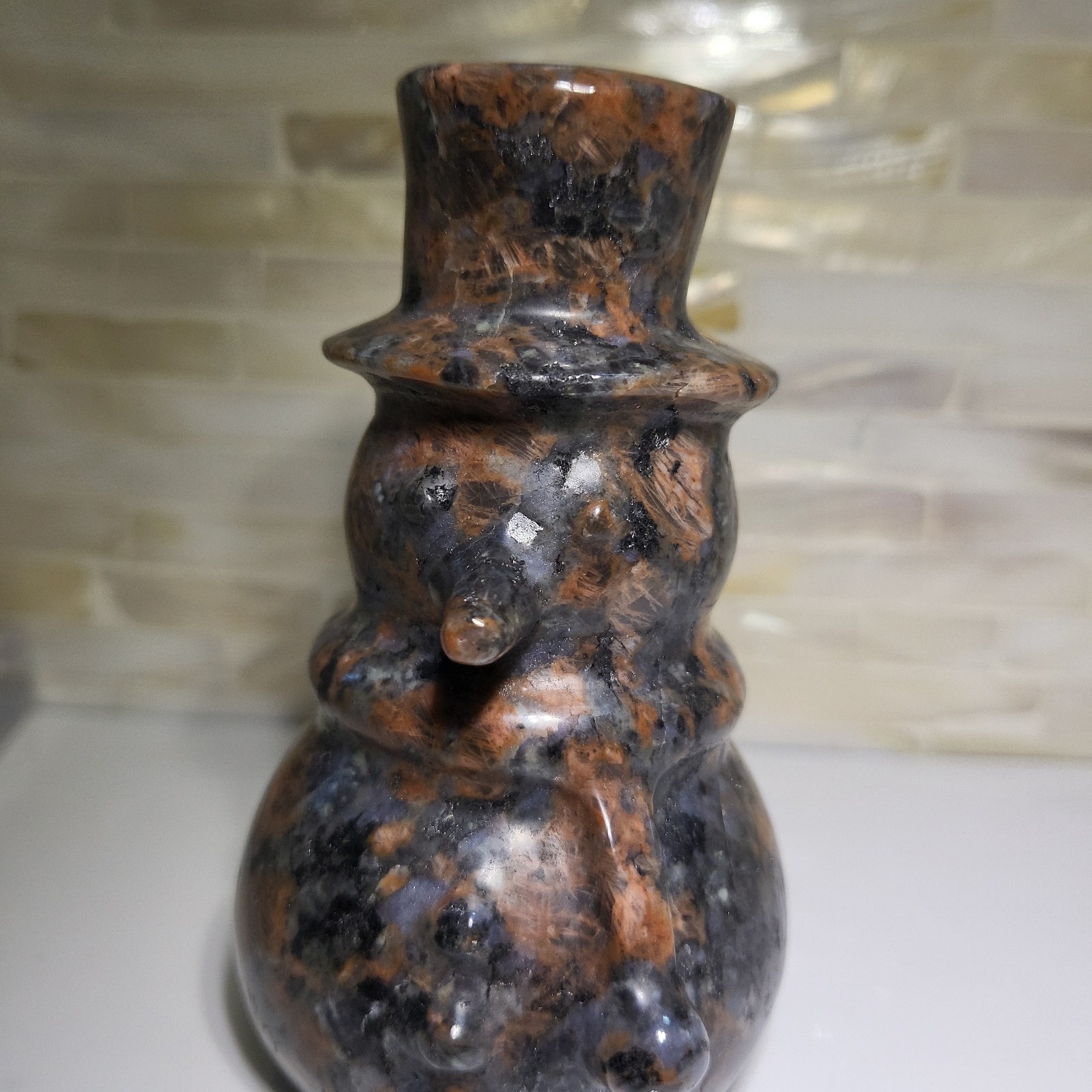 Red spectrolite Snowman carving 3588