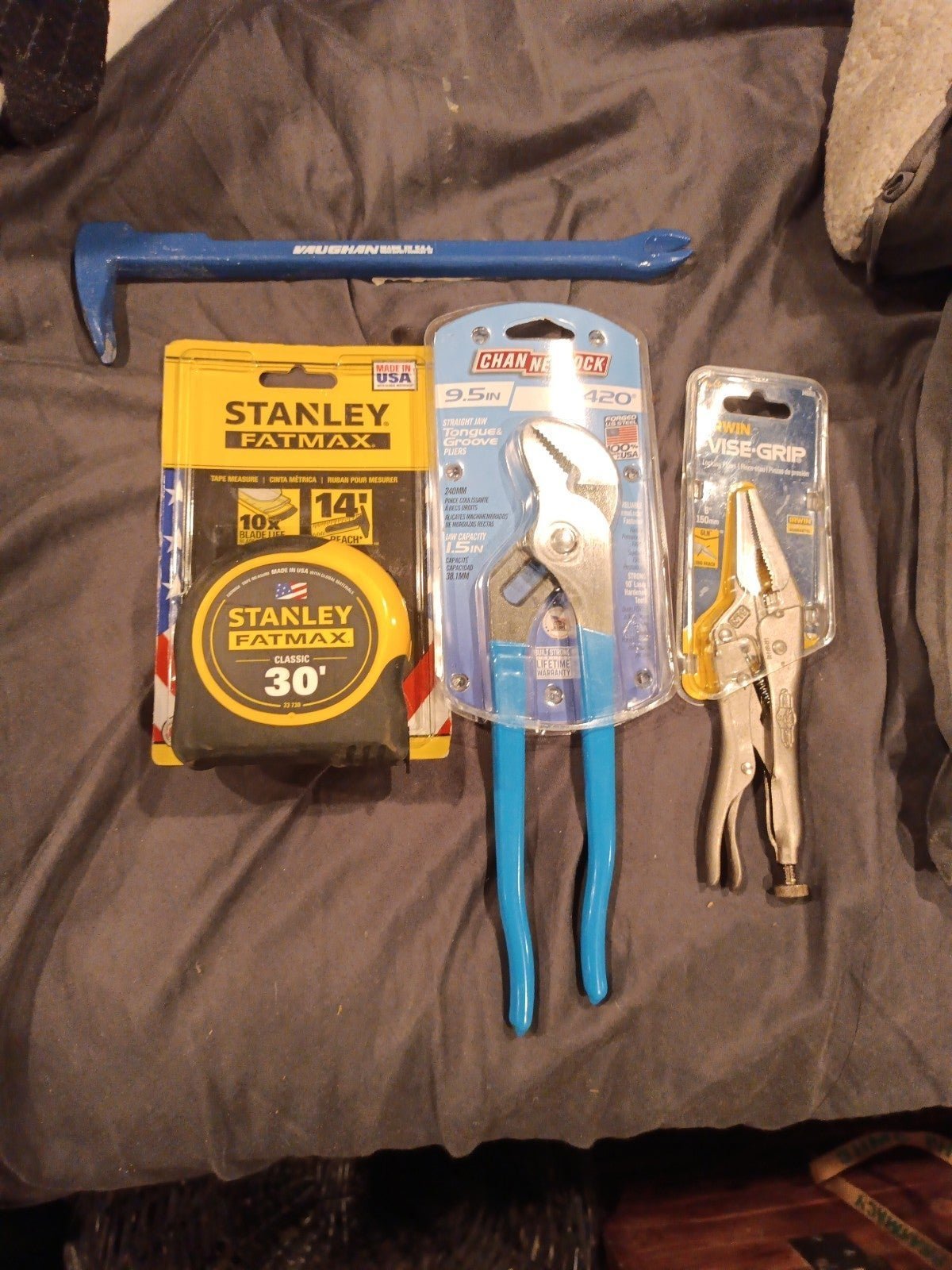 Tape measure cat's paw channel locks and vice grips