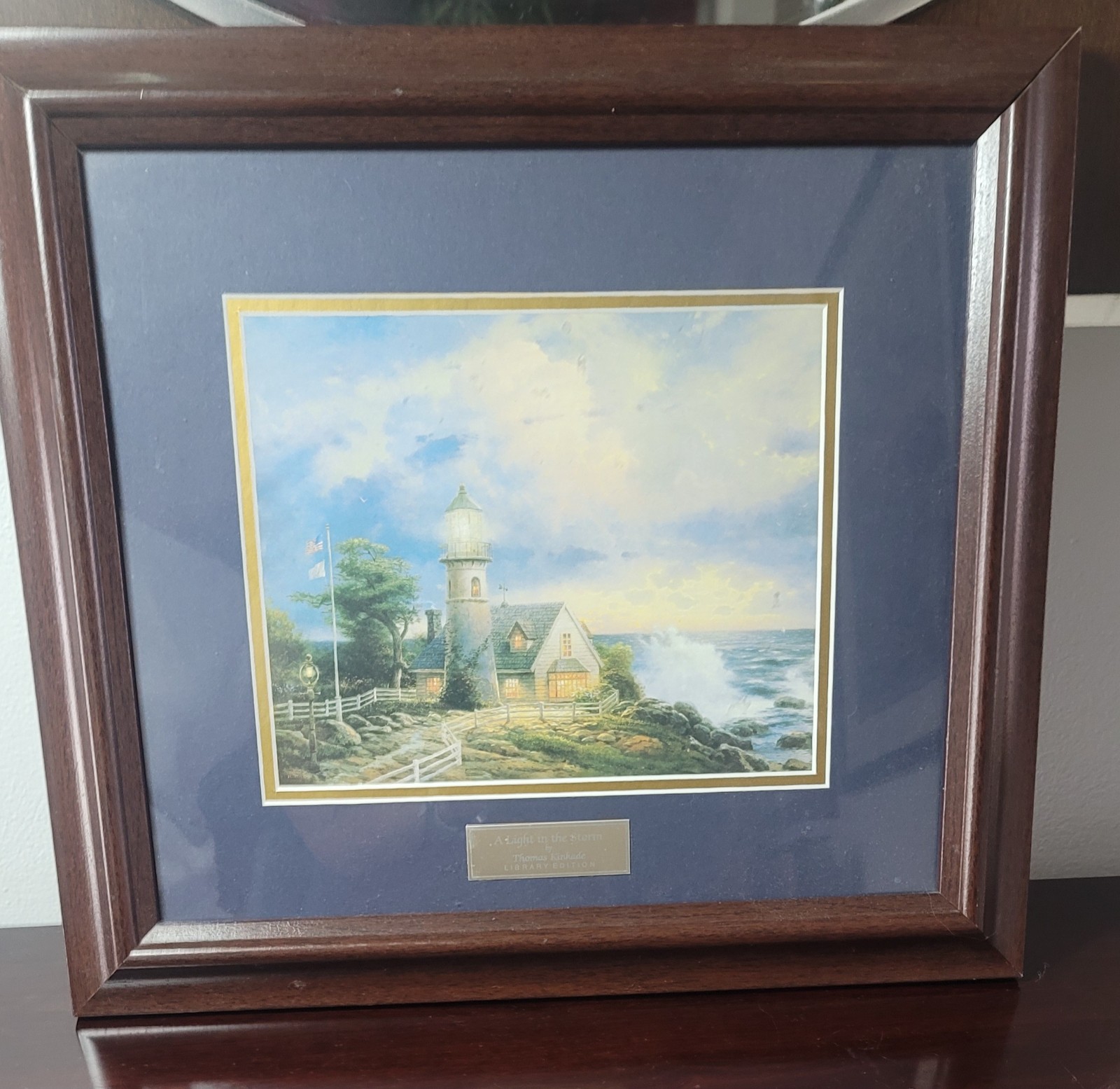 Thomas Kinkade, titled A Light In The Storm Library Edition\
