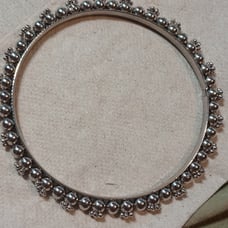 Vintage bangle at least 80 plus years old not for sure what it's made out of