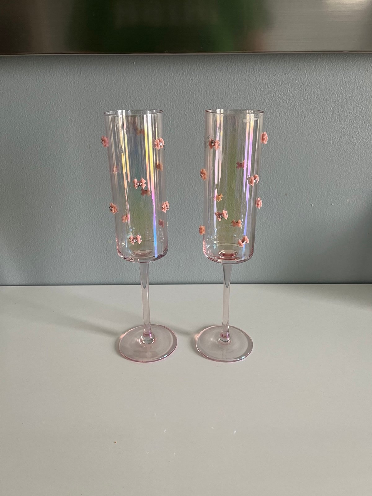 Two pink bow flute glasses