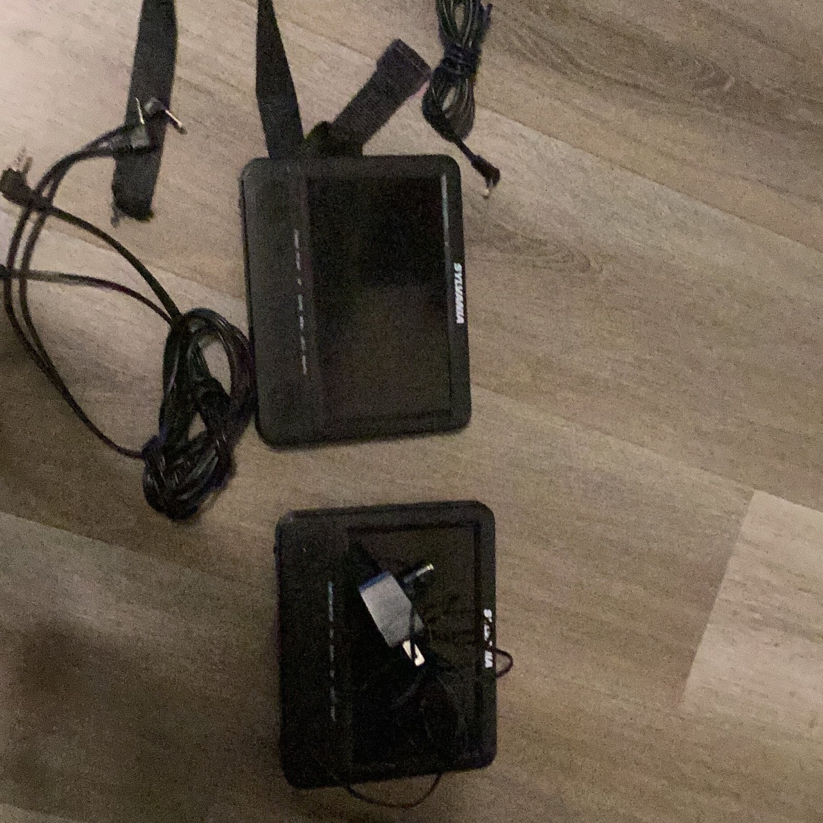 SYLVANIA portable DVD player with cables, and it works