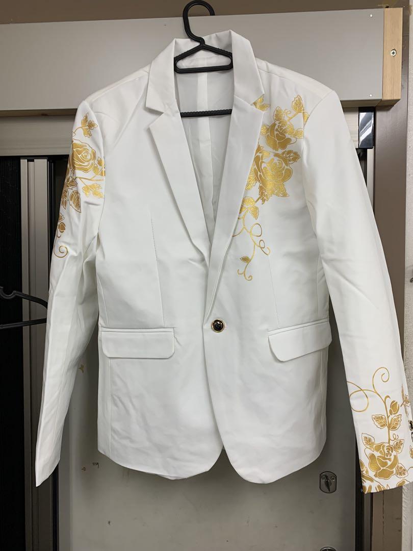 White tailored jacket with gold embroidery.