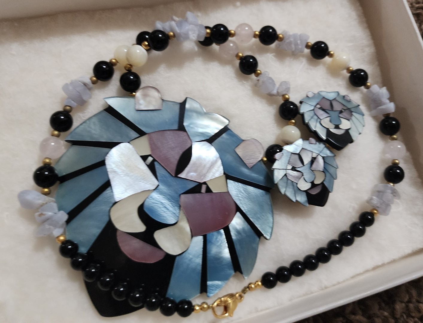 Lee sands mother of pearl necklace and earrings set.