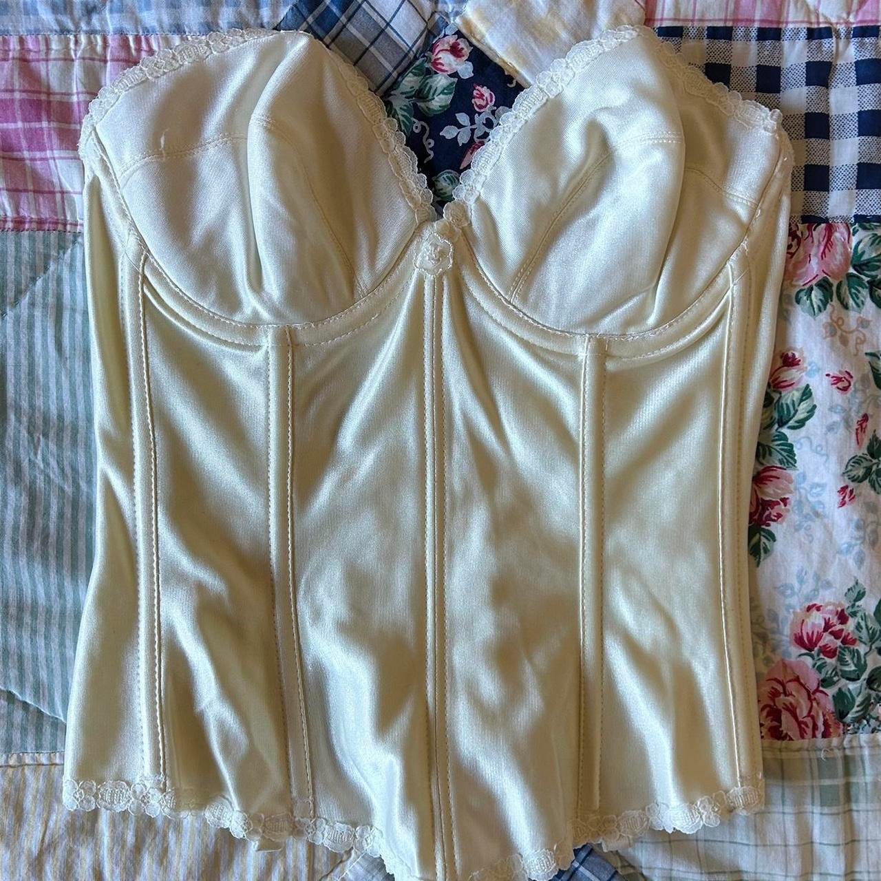 Coquette vintage 90s cream corset top with lace trim and clasp back closure.