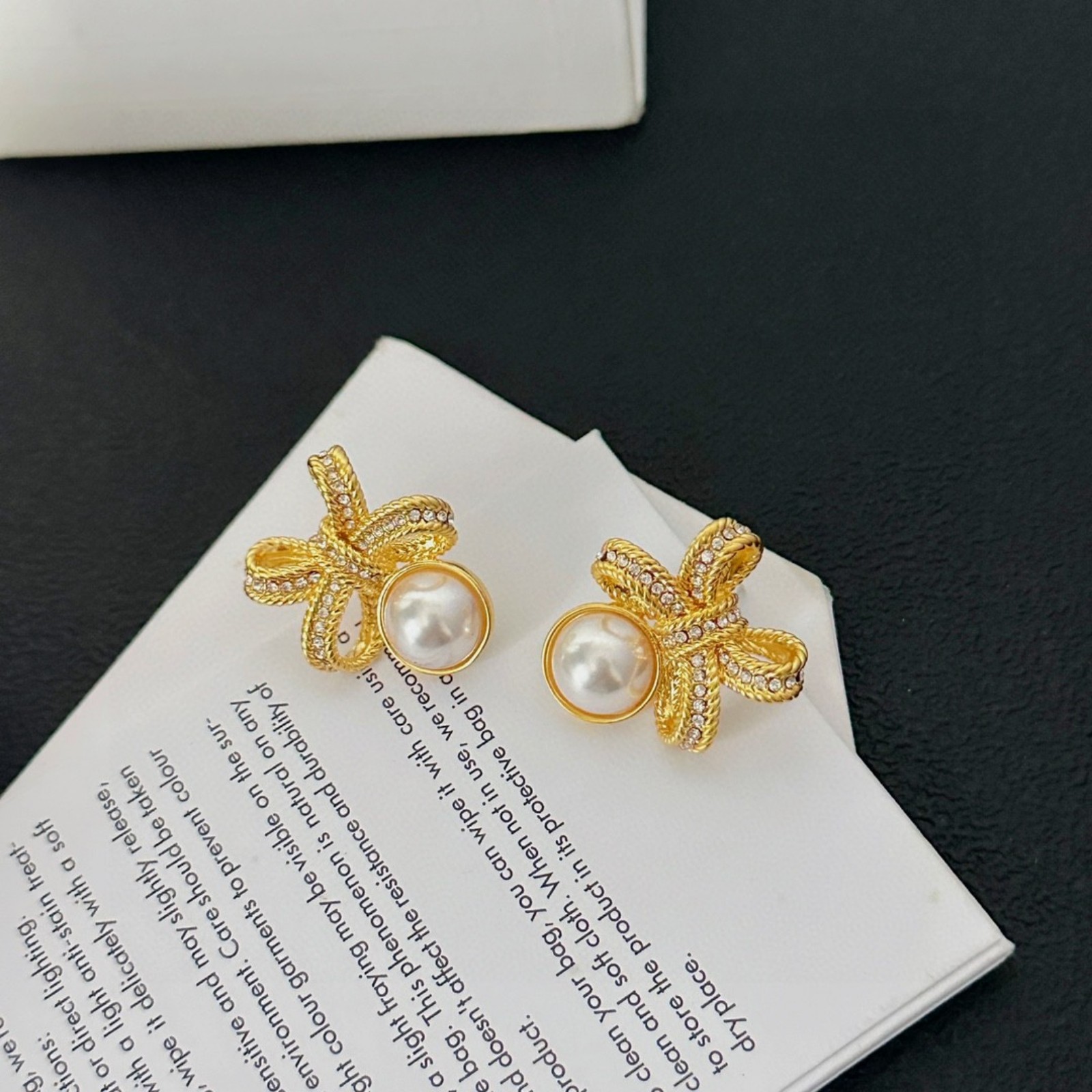 Gold bow stud earrings