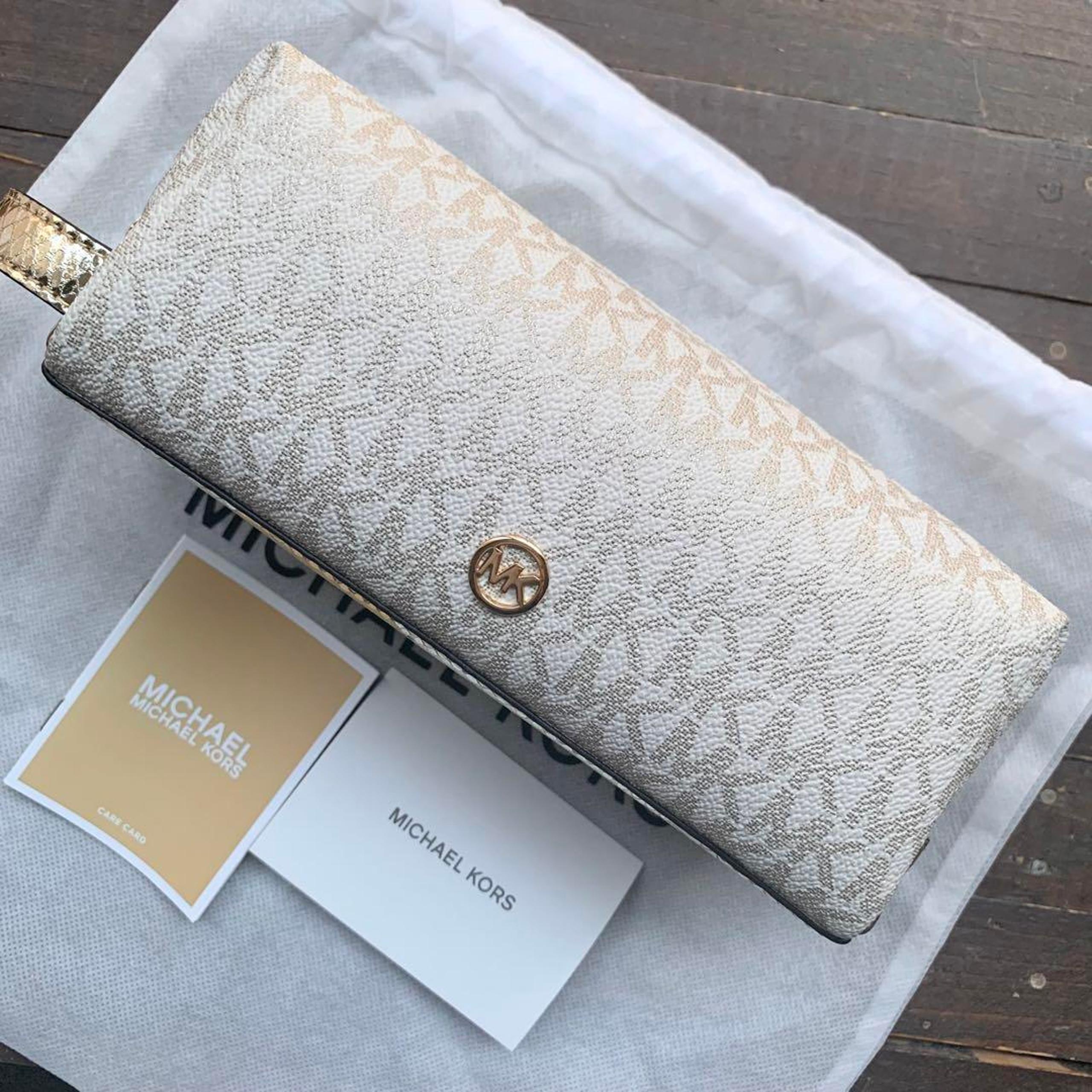 Brand new, unused Michael Kors travel pouch, Signature pale gold.