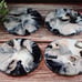 Ceramic coasters have high gloss resin, 4 piece black, cream, and silver