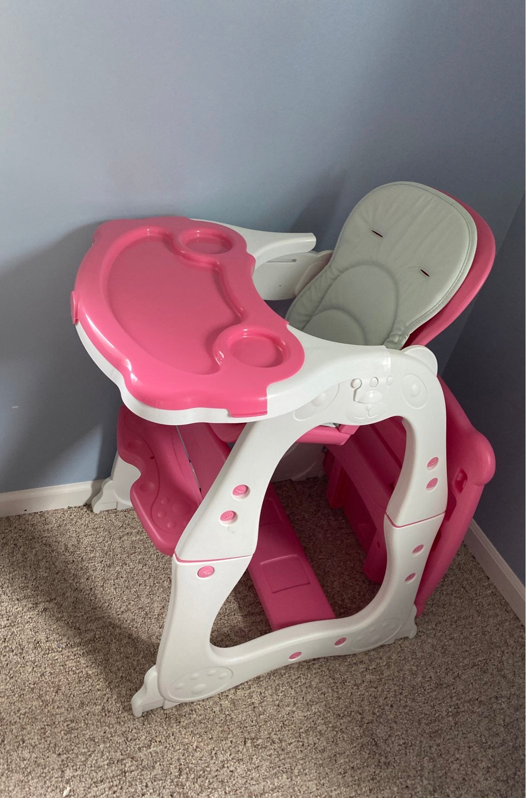 A pink highchair