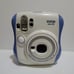 Fujifilm Cheki instax mini 26 Lens 60mm Focus Range 0.5m ~ infinity.